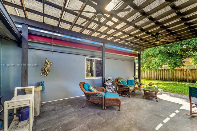 a backyard with hardwood wall and deck