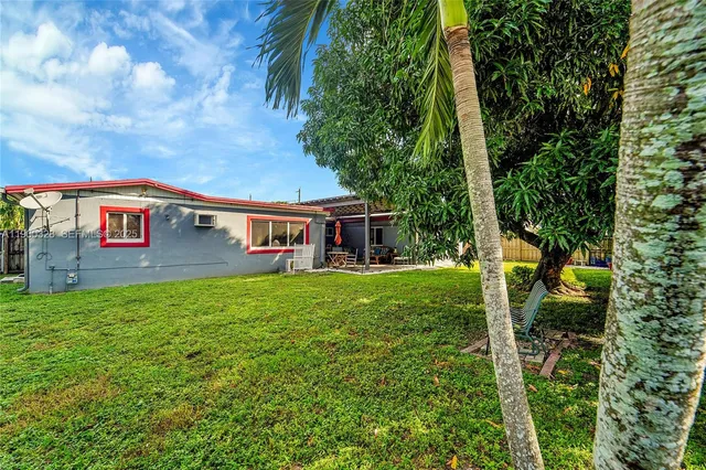 a backyard of a house with seating space
