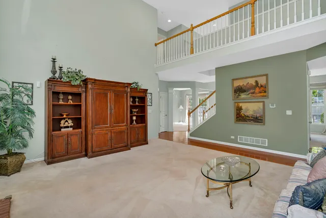 a kitchen with kitchen island granite countertop wooden floors granite counter tops and a window