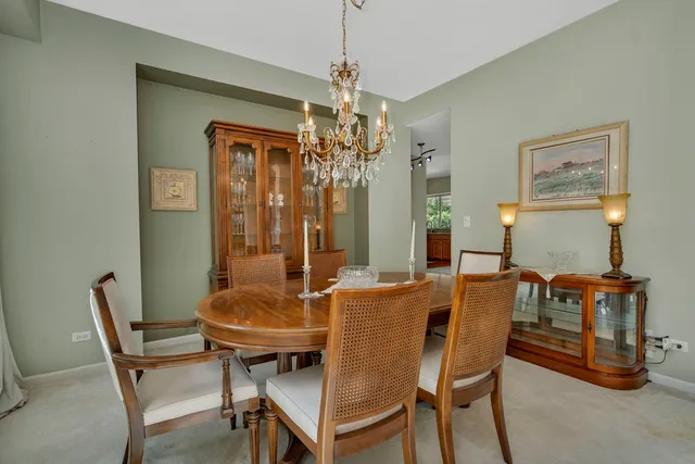 a white toilet sitting next to a white wall