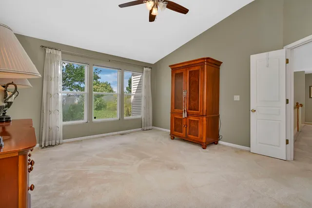 a bathroom with a granite countertop sink a toilet and a mirror