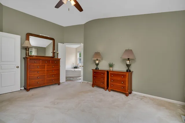 a view of a patio with a table chairs and a backyard