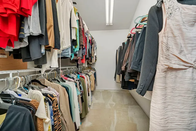 a front view of a house with a garden and yard