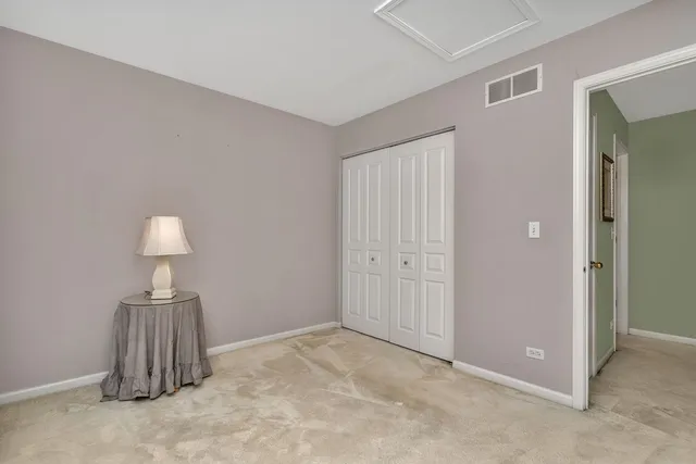 a picture of a room with a white wall and a picture