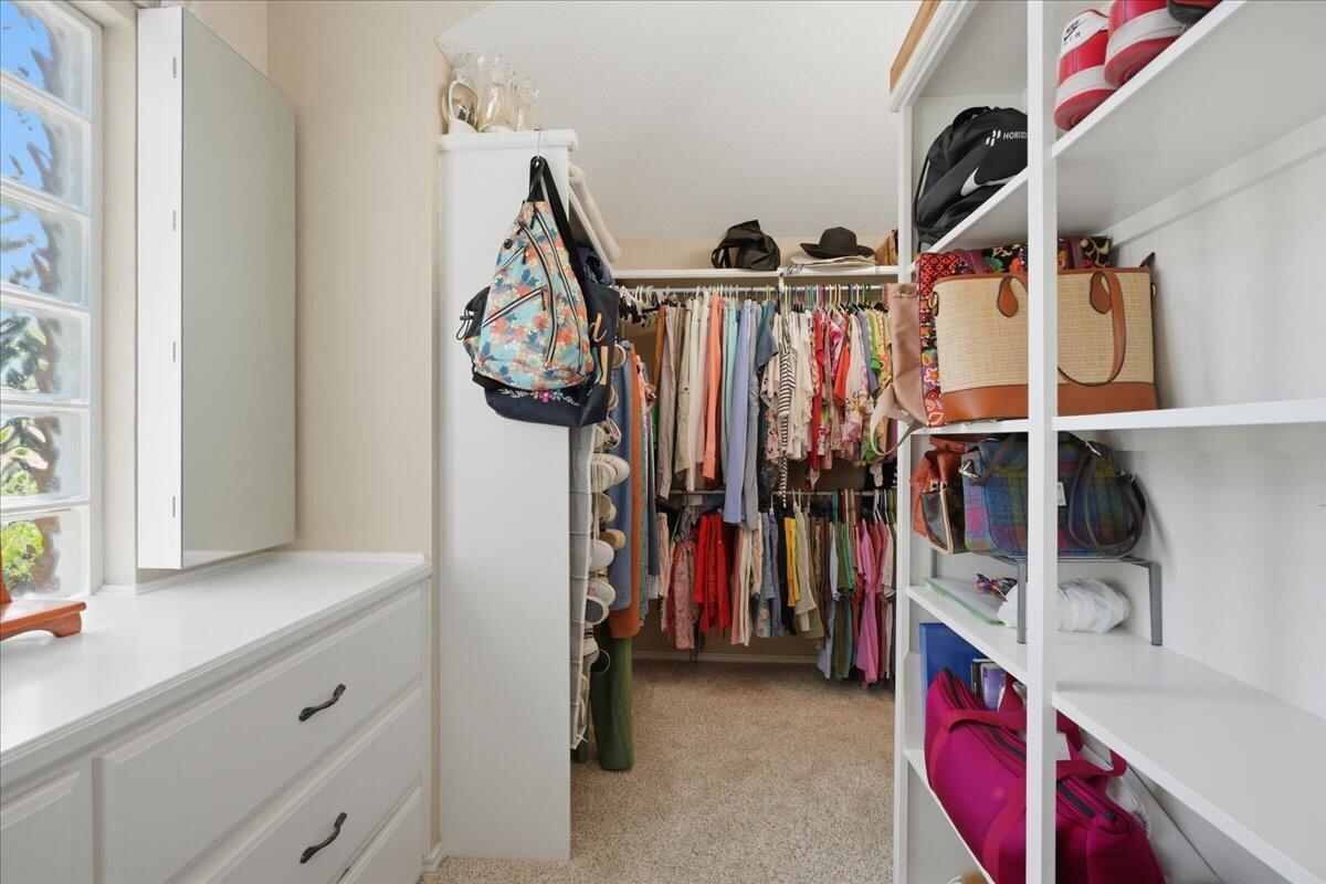 4612 100th Street Lubbock, TX 79424 - Photo 35 of 55 a view of walk in closet with clothes and shoes