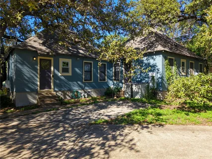 a house view with a backyard space