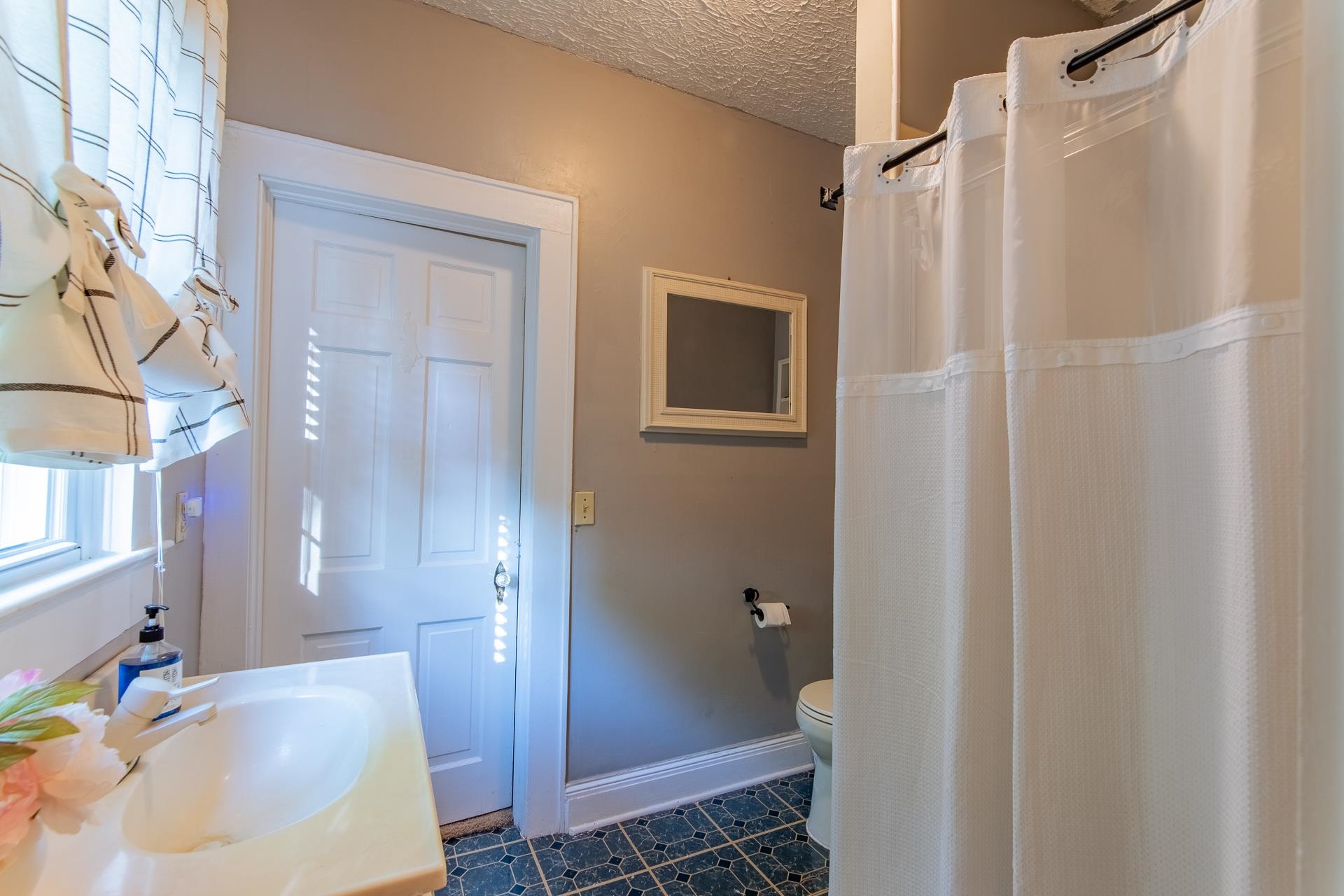 4083 57th Highway West Ramer, TN 38367 - Photo 18 of 40 a bathroom with a sink and a mirror