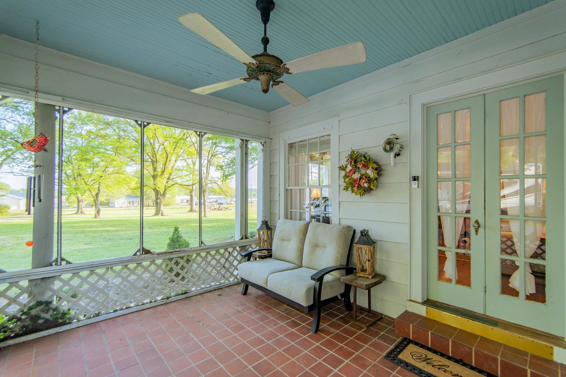 4083 57th Highway West Ramer, TN 38367 - Photo 29 of 40 a living room with furniture and a floor to ceiling window