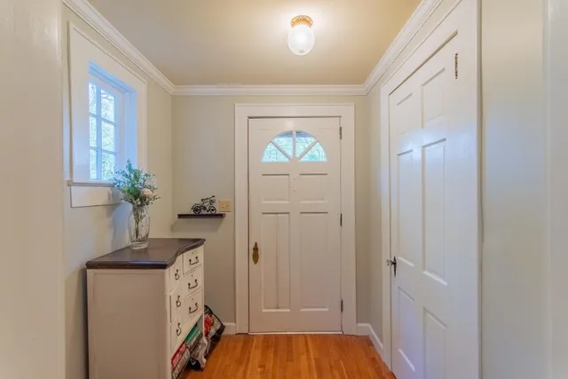 a room that has a bed and a mirror in it