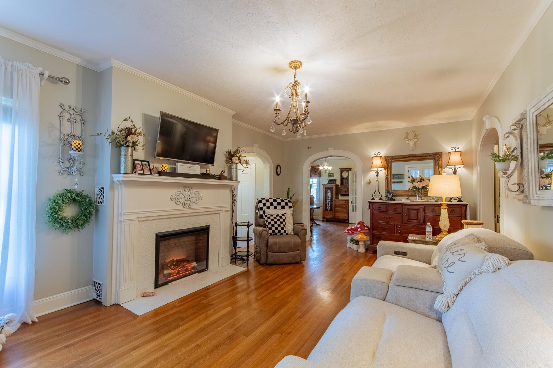 4083 57th Highway West Ramer, TN 38367 - Photo 6 of 40 a living room with furniture a fireplace and a flat screen tv