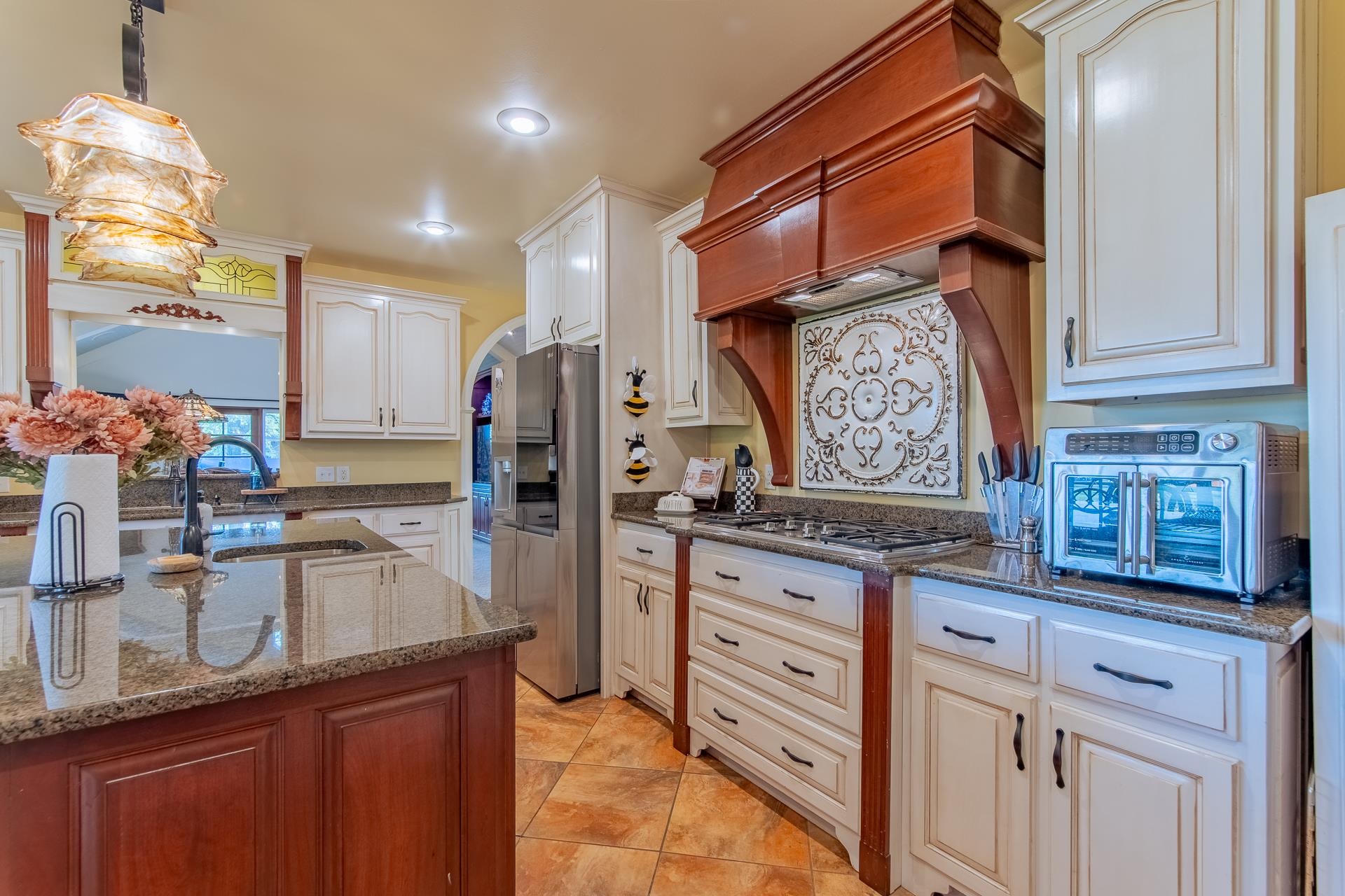 4083 57th Highway West Ramer, TN 38367 - Photo 9 of 40 a kitchen with stainless steel appliances granite countertop a sink stove and refrigerator