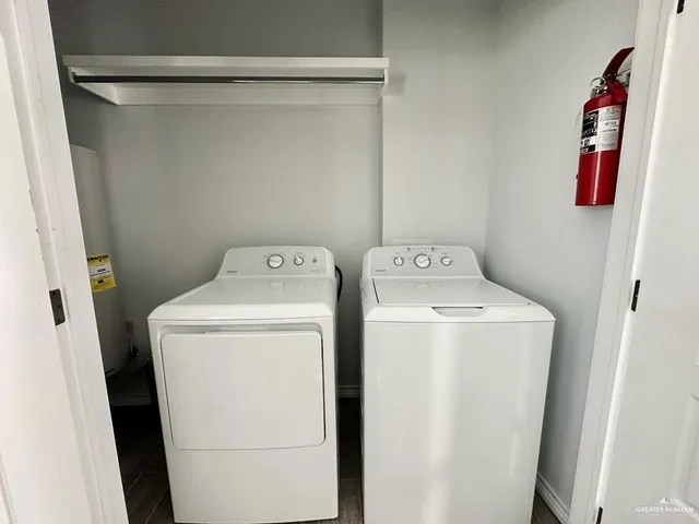 a view of green field with house in the background