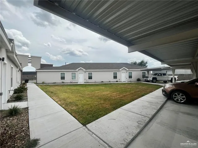 a swimming pool view with a outdoor seating