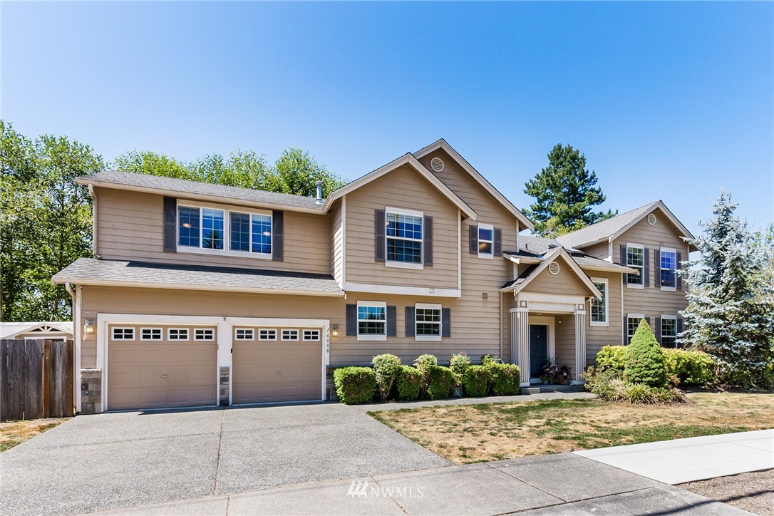 16008 Sunset Road Bothell, WA 98012 - Photo 1 of 28 a front view of a house with a yard