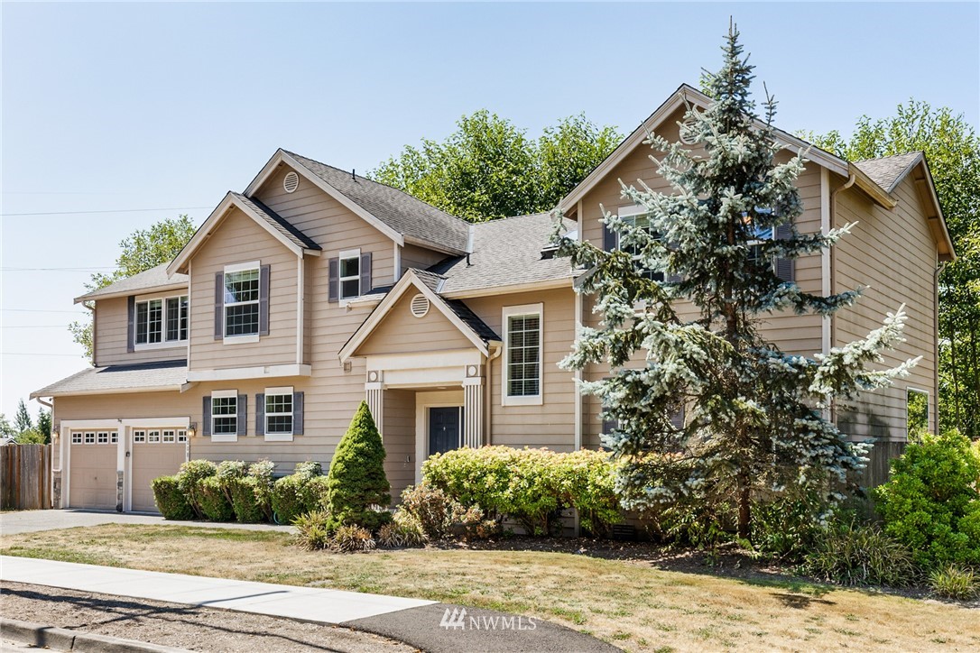 16008 Sunset Road Bothell, WA 98012 - Photo 2 of 28 a front view of a house with a yard