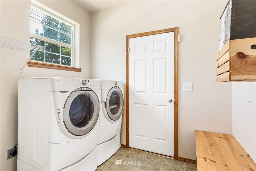 16008 Sunset Road Bothell, WA 98012 - Photo 12 of 28 a utility room with dryer and washer