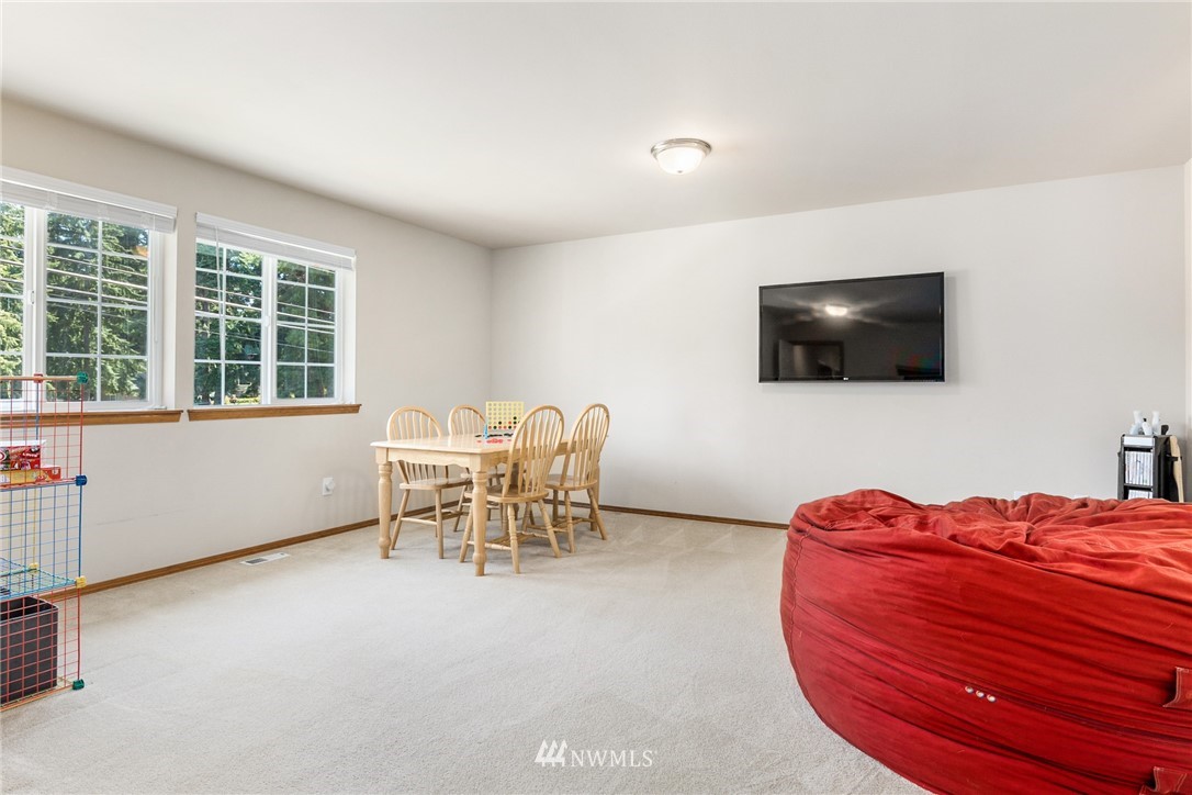 16008 Sunset Road Bothell, WA 98012 - Photo 18 of 28 a projector room with a chair and a flat screen tv