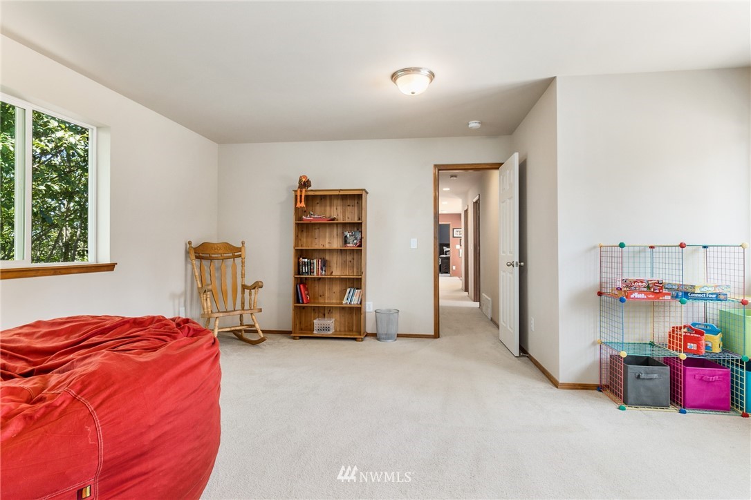 16008 Sunset Road Bothell, WA 98012 - Photo 19 of 28 a view of an empty room with window and closet