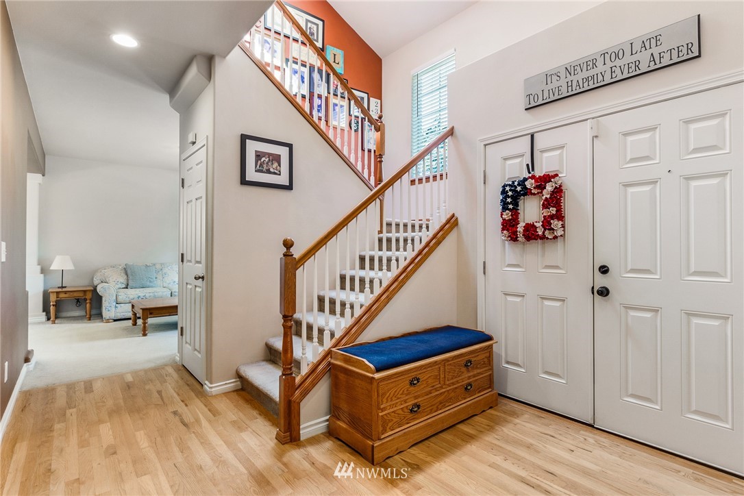 16008 Sunset Road Bothell, WA 98012 - Photo 3 of 28 a view of entryway with wooden floor and stairs