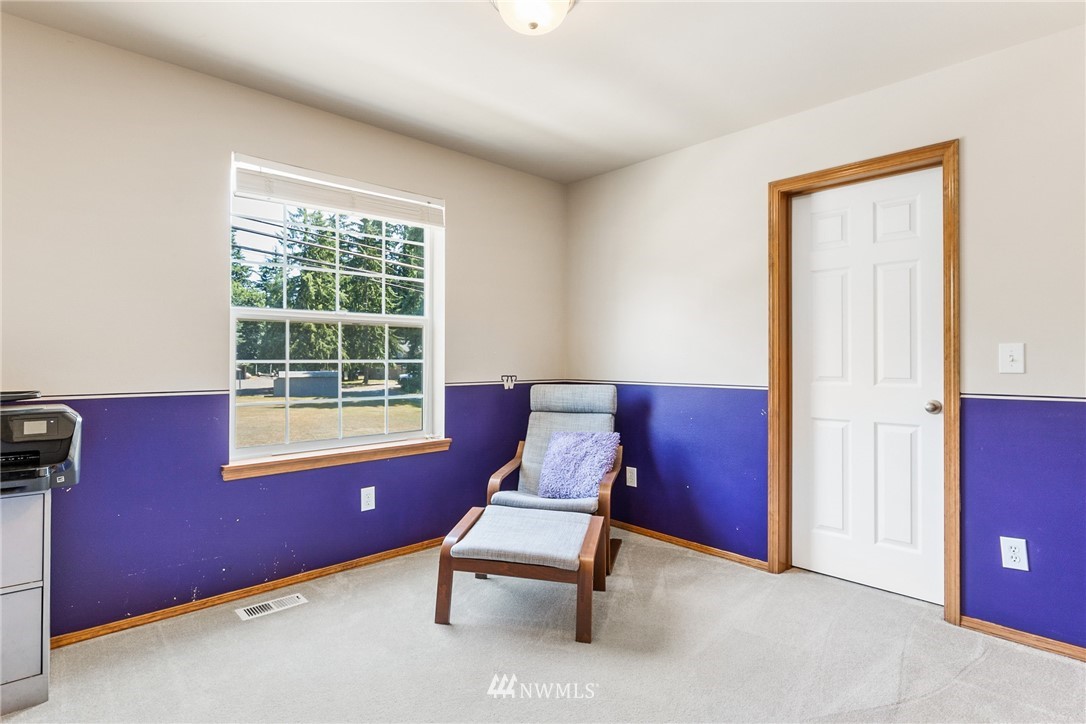 16008 Sunset Road Bothell, WA 98012 - Photo 22 of 28 a room with furniture and windows