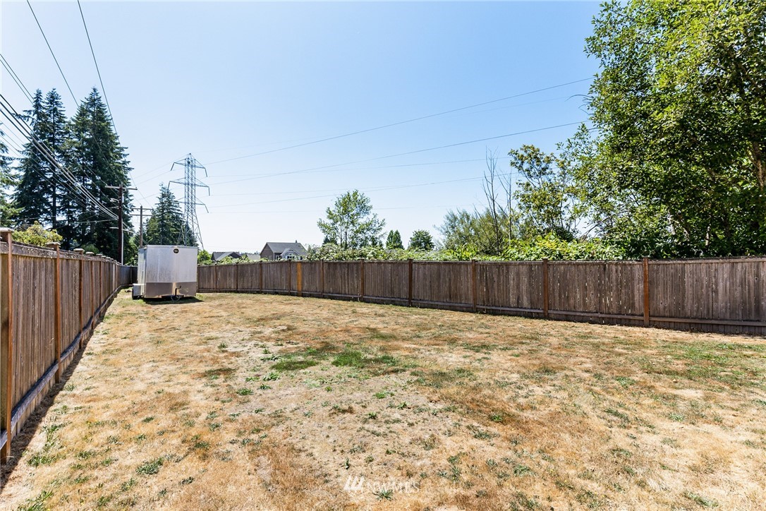 16008 Sunset Road Bothell, WA 98012 - Photo 25 of 28 a view of backyard with wooden fence