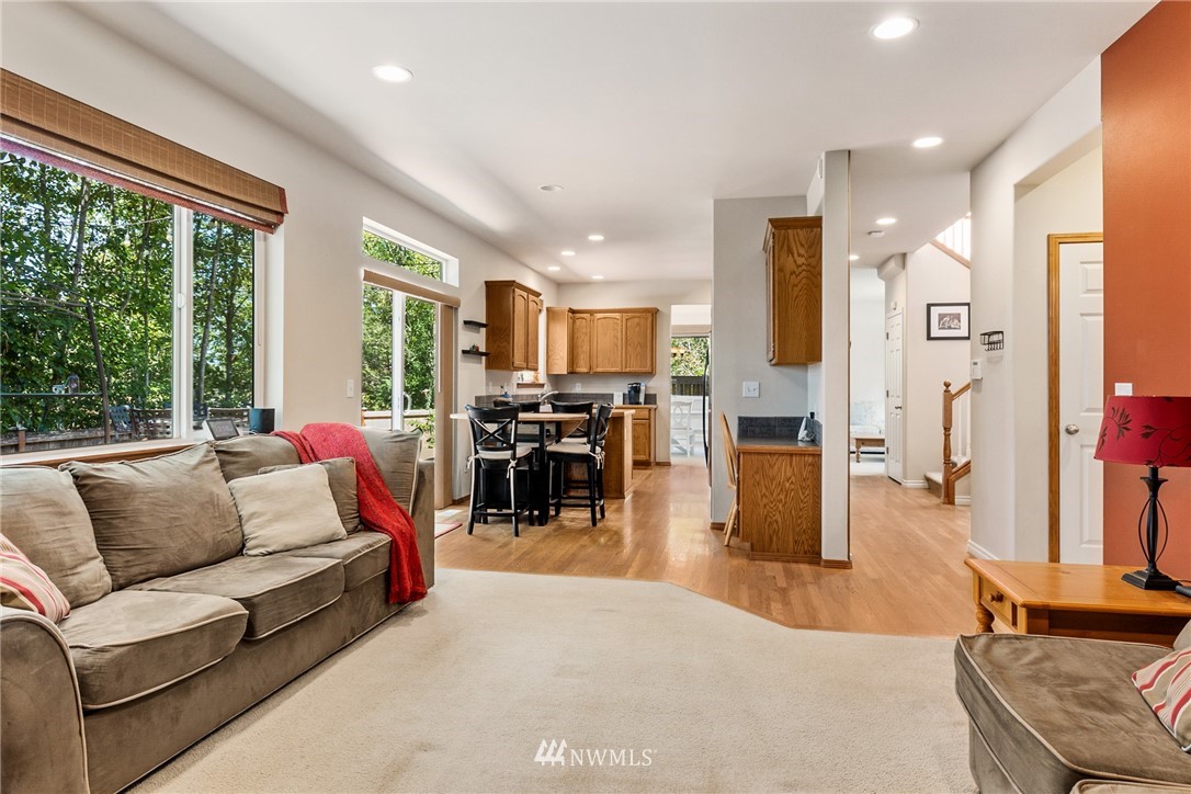 16008 Sunset Road Bothell, WA 98012 - Photo 5 of 28 a living room with furniture and a large window