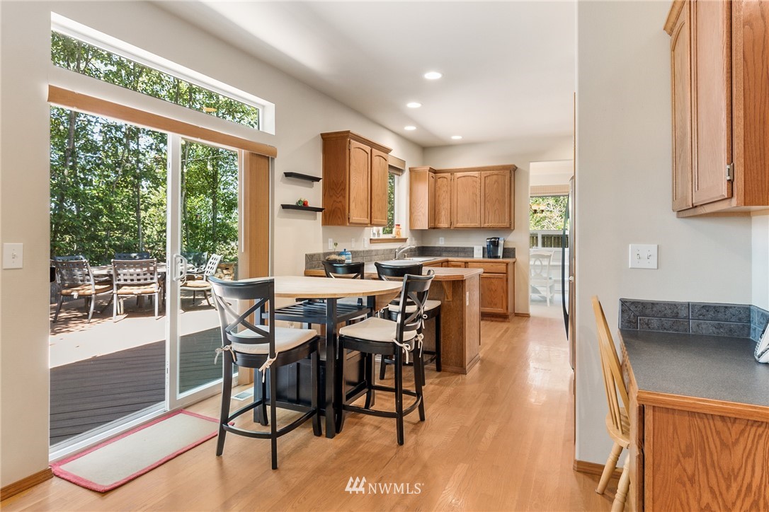 16008 Sunset Road Bothell, WA 98012 - Photo 6 of 28 a view of a dining room kitchen and furniture