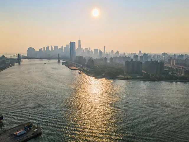 a front view of a house with a yard and outdoor seating