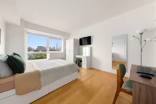 a living room with furniture and white walls