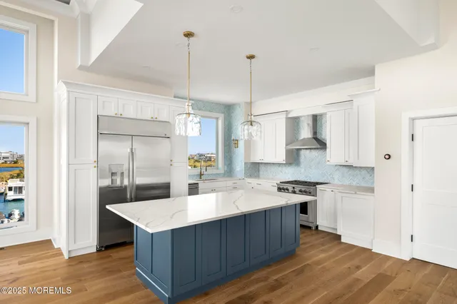 a view of an empty room with window and fire place