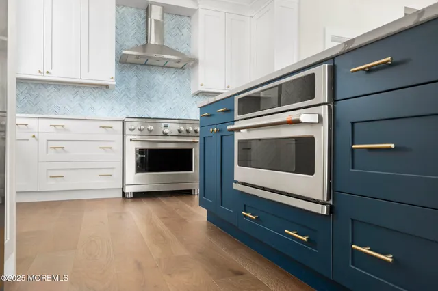 an empty room with entrance and windows