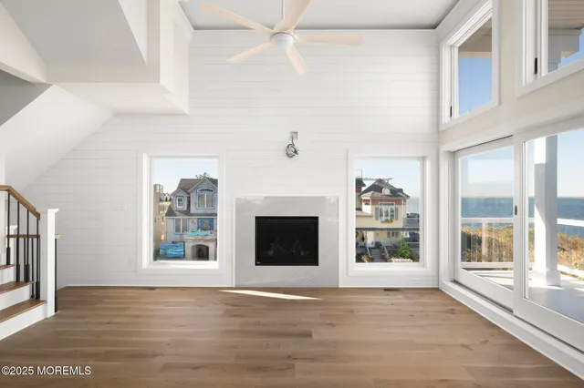 a bathroom with a sink a mirror a toilet and shower