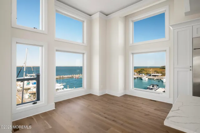 a bathroom with a toilet a sink a mirror and vanity