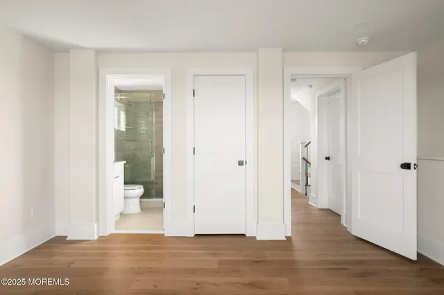 a view of a balcony with wooden floor
