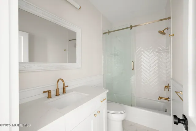 an aerial view of a house with a ocean view