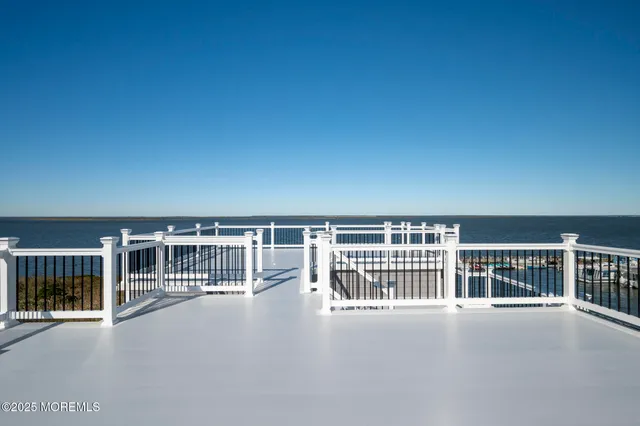 an aerial view of a house with ocean view