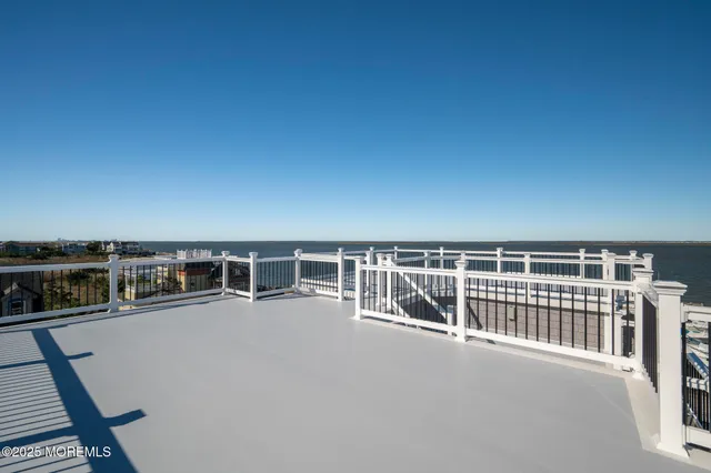 a front view of a house with a garden and plants