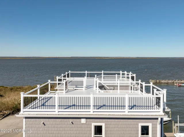 a kitchen with a refrigerator and a stove top oven
