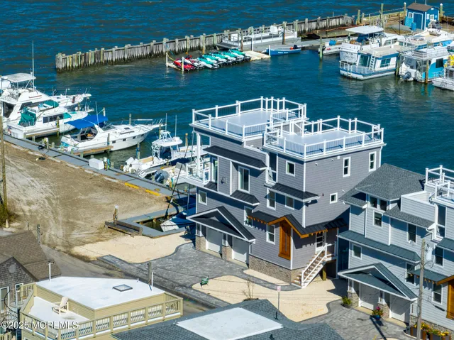 a kitchen with kitchen island a sink stainless steel appliances and cabinets