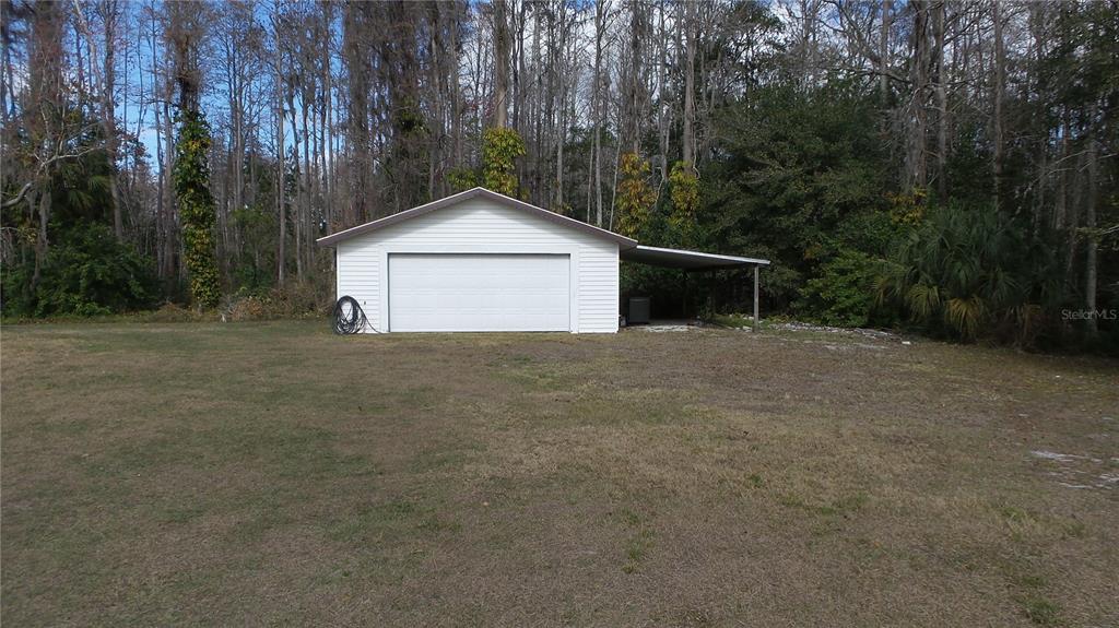 10127 Fox Squirrel Drive New Port Richey, FL 34654 - Photo 3 of 18 a view of a house with a yard