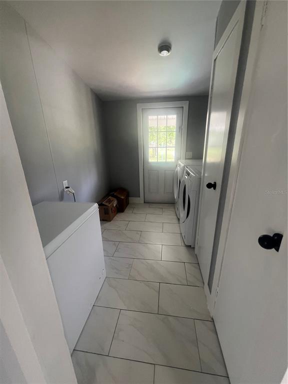 5855 Jack Brack Road St. Cloud, FL 34771 - Photo 69 of 86 a bathroom with a sink a toilet and a mirror