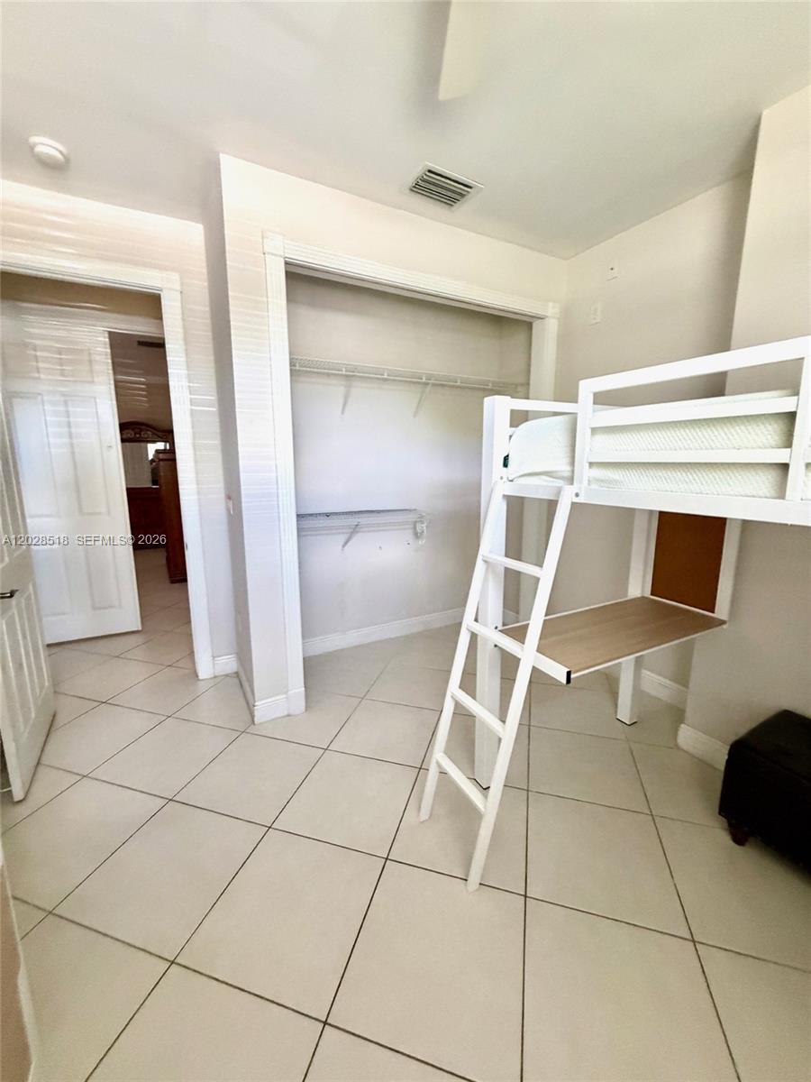 9444 Southwest 78th Street Miami, FL 33173 - Photo 8 of 11 a view of a livingroom with white furniture