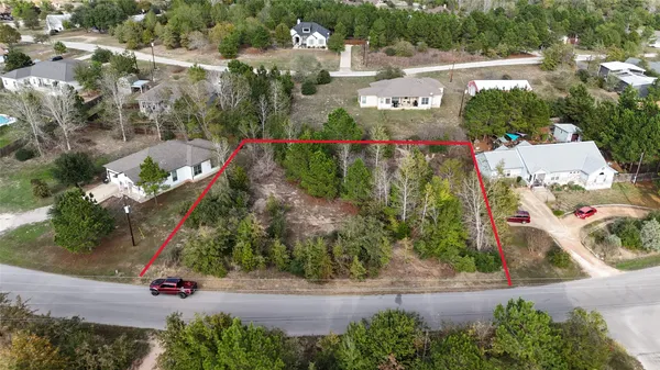 an aerial view of a house with yard swimming pool and outdoor seating