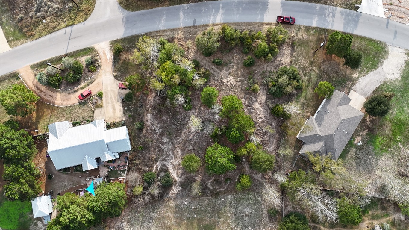Tbd Cardinal Drive Paige, TX 78659 - Photo 9 of 12 an aerial view of residential house with outdoor space and trees all around