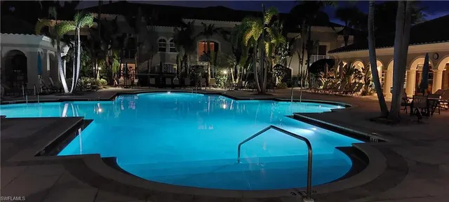 a view of a house with backyard swimming pool