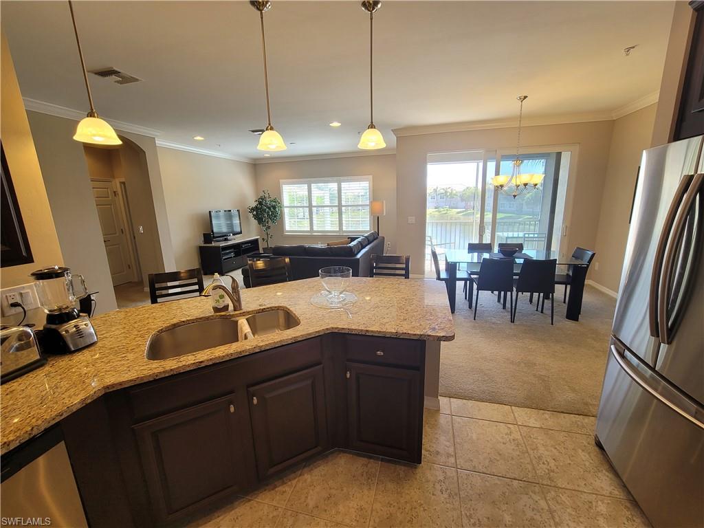 8561 Violeta Street, Unit 202 Estero, FL 34135 - Photo 13 of 40 a bathroom with a sink double vanity and a mirror