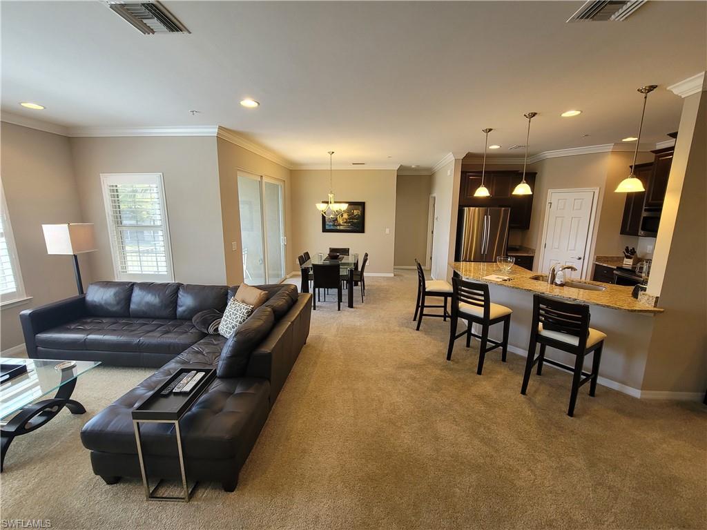 8561 Violeta Street, Unit 202 Estero, FL 34135 - Photo 25 of 40 a living room with furniture