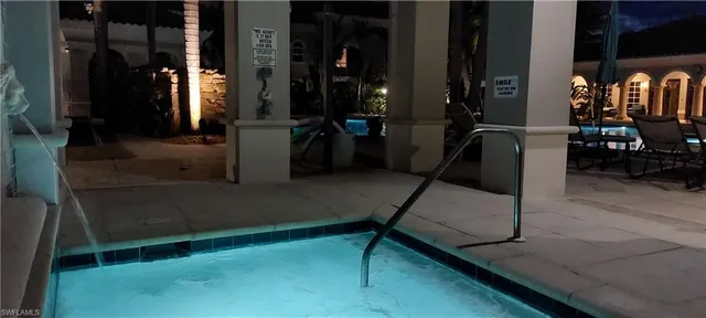 a view of swimming pool with chairs