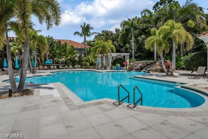 8561 Violeta Street, Unit 202 Estero, FL 34135 - Photo 35 of 40 a view of swimming pool with chairs