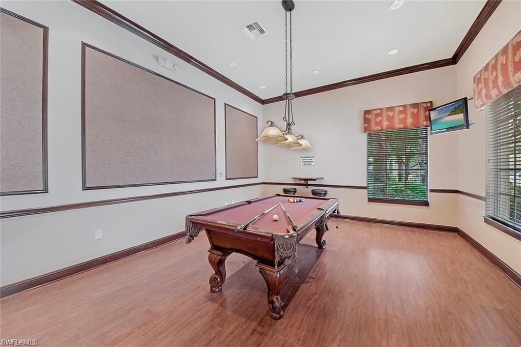 8561 Violeta Street, Unit 202 Estero, FL 34135 - Photo 38 of 40 a room with wooden floor and window